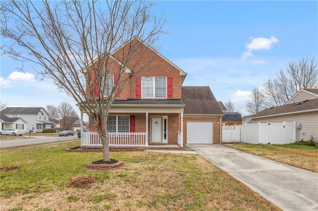 traditional-style home with fence, covered porch, concrete driveway, a garage, and brick siding