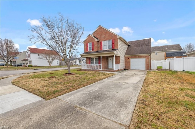 traditional home with a front lawn, a porch, brick siding, and driveway