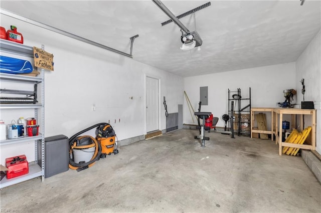 garage with electric panel and a garage door opener