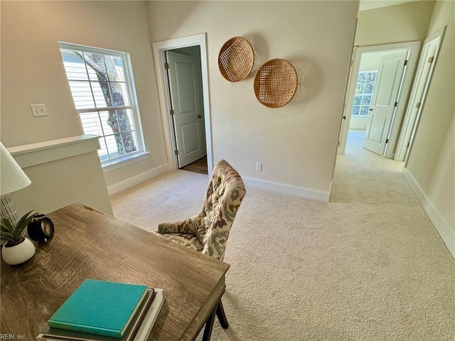 interior space featuring carpet flooring and baseboards