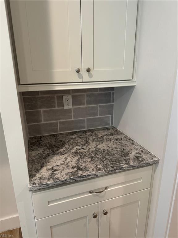 interior details featuring decorative backsplash