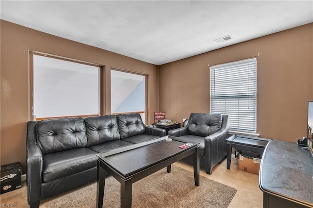 living room with light colored carpet and visible vents