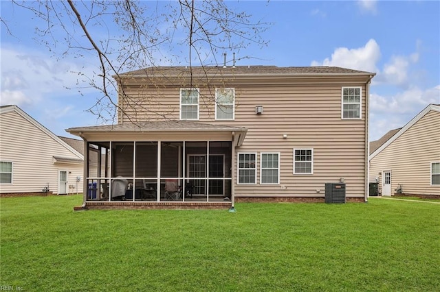 back of house with a lawn, central AC unit, and a sunroom