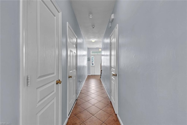 corridor with tile patterned flooring