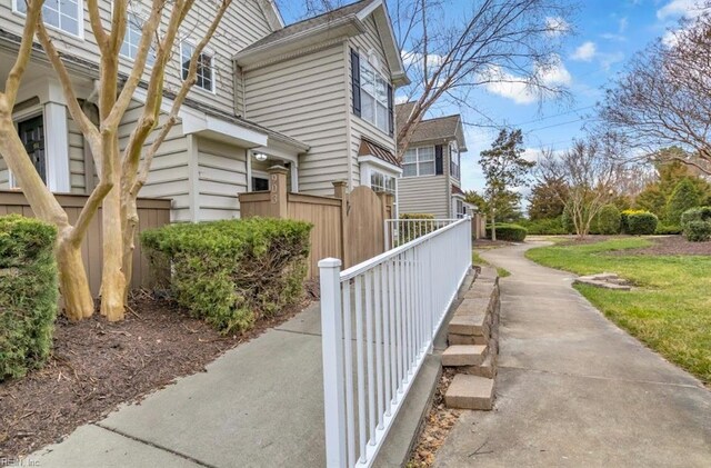 view of side of home with fence