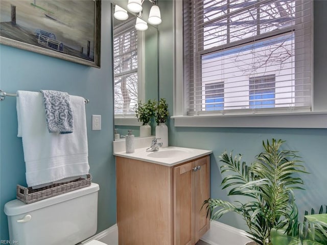 bathroom featuring toilet and vanity