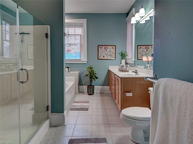 full bathroom featuring toilet, a shower stall, tile patterned flooring, a bath, and vanity