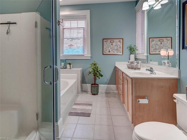 bathroom with tile patterned flooring, a stall shower, toilet, and vanity