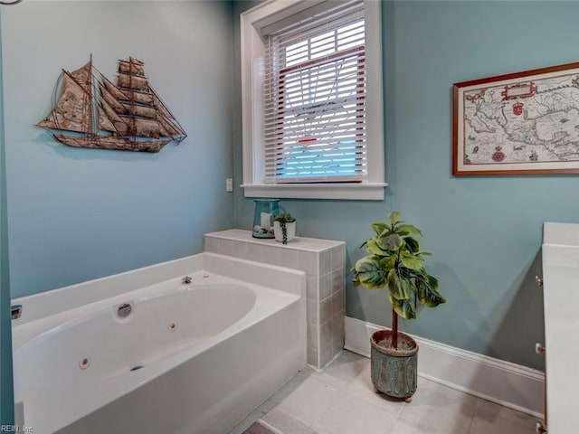 full bath featuring tile patterned flooring, a jetted tub, and baseboards