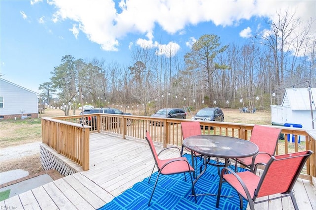 deck featuring outdoor dining area