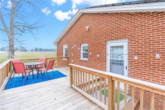 wooden deck with outdoor dining area