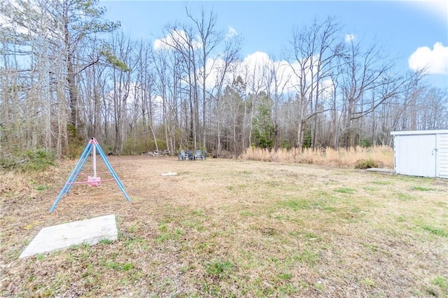 view of yard with a shed and an outdoor structure