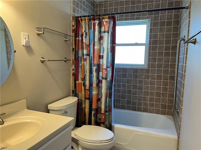 full bath featuring vanity, toilet, and shower / tub combo