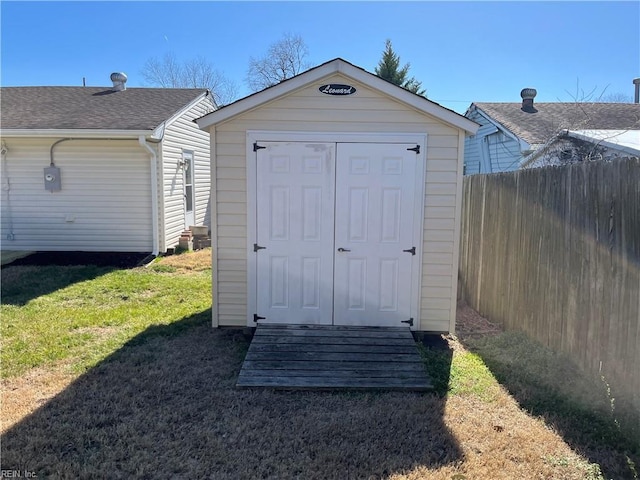 view of shed with fence