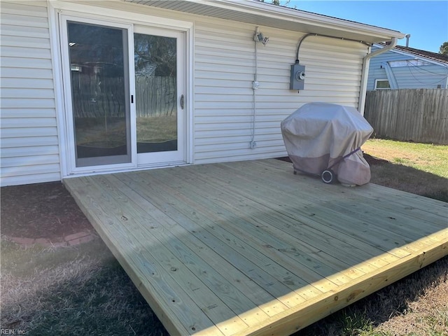 deck featuring a grill and fence