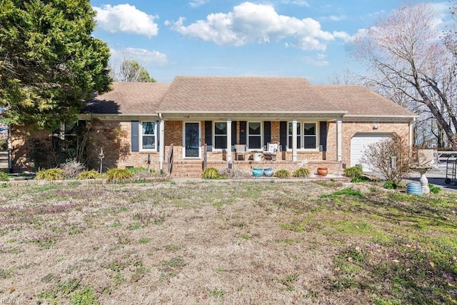 ranch-style home with brick siding, a porch, a shingled roof, and a garage