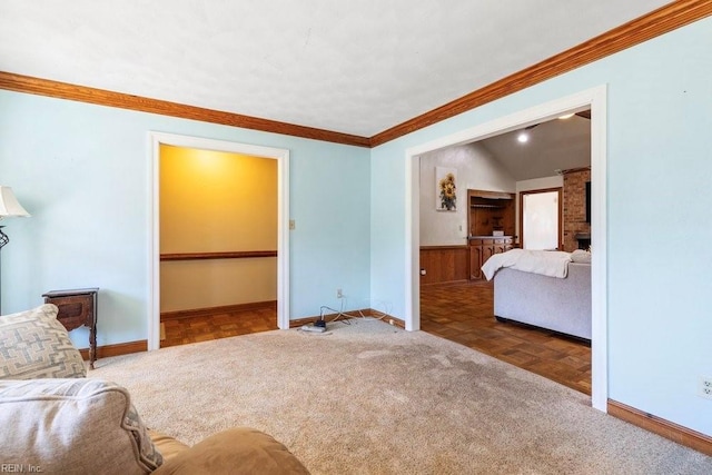 living room with carpet flooring, baseboards, and ornamental molding