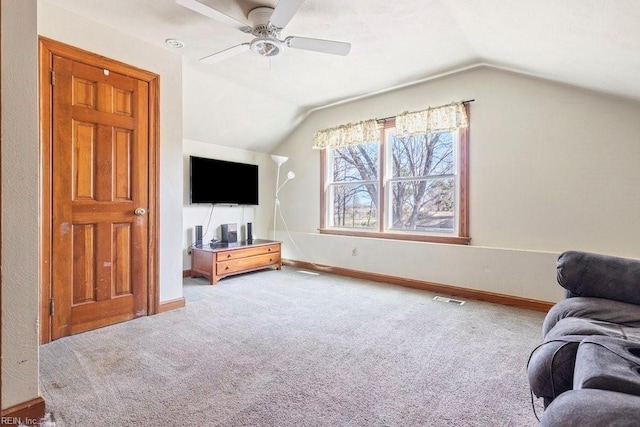 carpeted living room featuring visible vents, a ceiling fan, baseboards, and vaulted ceiling