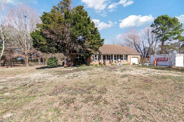 view of front of home with a garage and a front yard