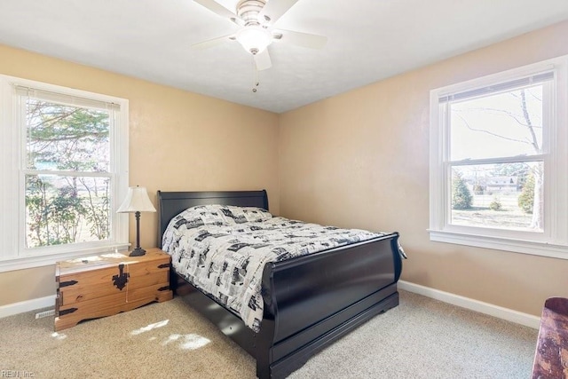 bedroom featuring a ceiling fan, carpet, and baseboards