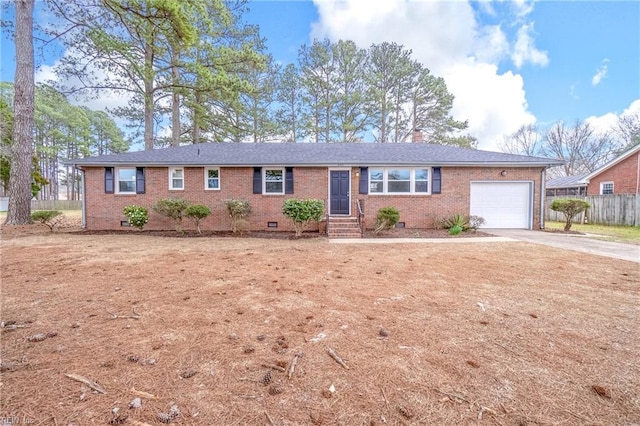 ranch-style home featuring crawl space, brick siding, concrete driveway, and an attached garage