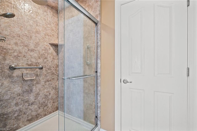 bathroom featuring a shower stall