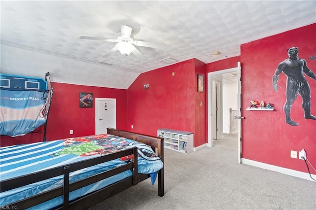 bedroom featuring a ceiling fan, lofted ceiling, carpet, and baseboards