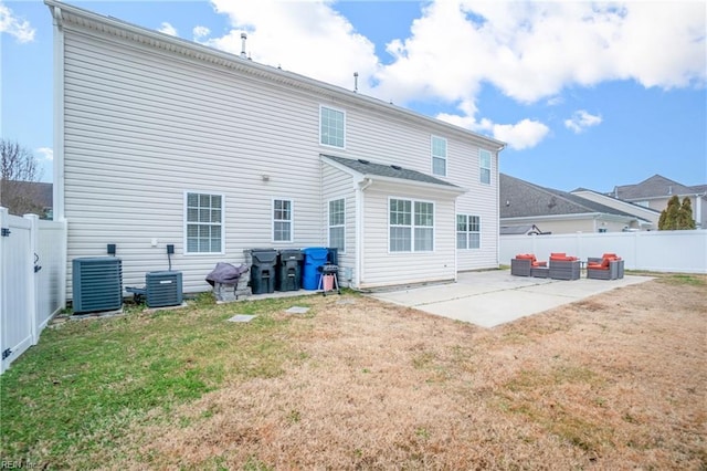 rear view of property featuring a yard, central air condition unit, a fenced backyard, and a patio