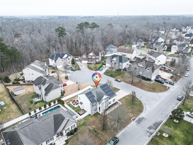 bird's eye view with a residential view and a forest view