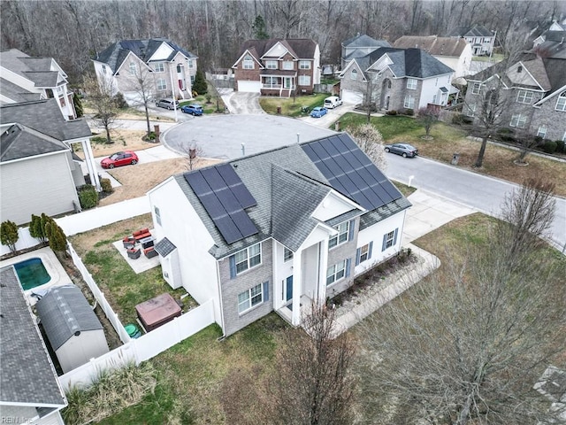 birds eye view of property with a residential view