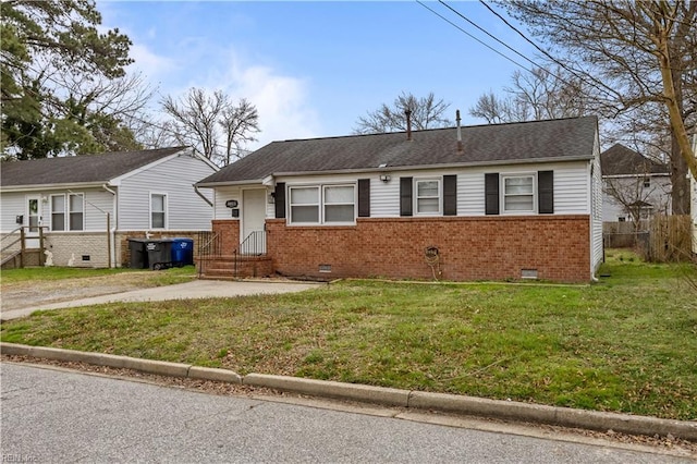 ranch-style home featuring crawl space, brick siding, and a front yard