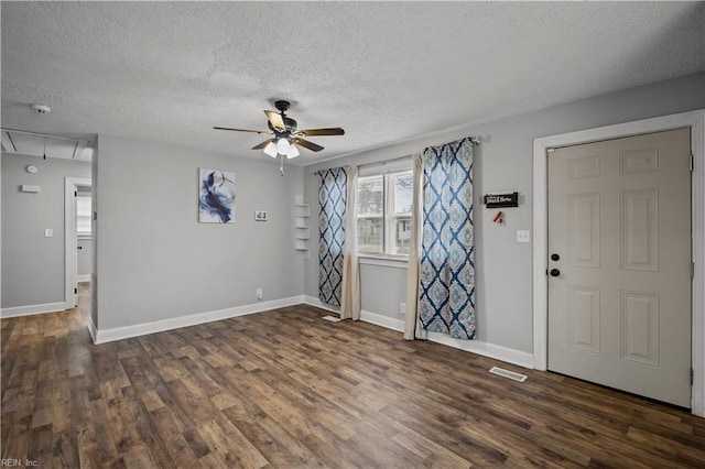 foyer featuring baseboards, dark wood-type flooring, and ceiling fan