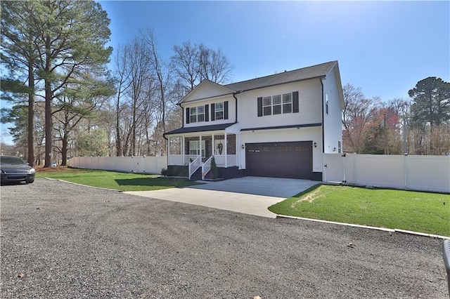 view of front of home with concrete driveway, an attached garage, fence, and a front lawn