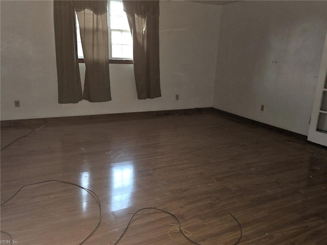 empty room with wood finished floors