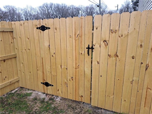 view of gate featuring fence