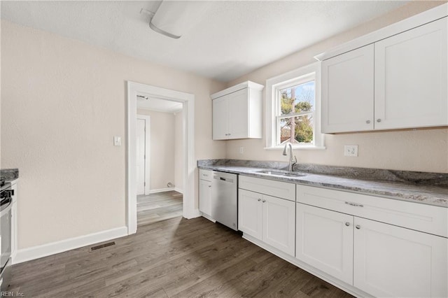 kitchen with visible vents, a sink, dark wood-style floors, baseboards, and dishwasher