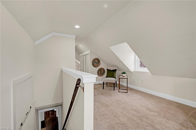 sitting room featuring carpet, baseboards, recessed lighting, vaulted ceiling, and an upstairs landing