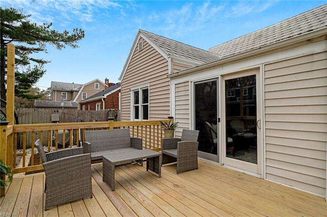 wooden deck featuring fence and an outdoor hangout area