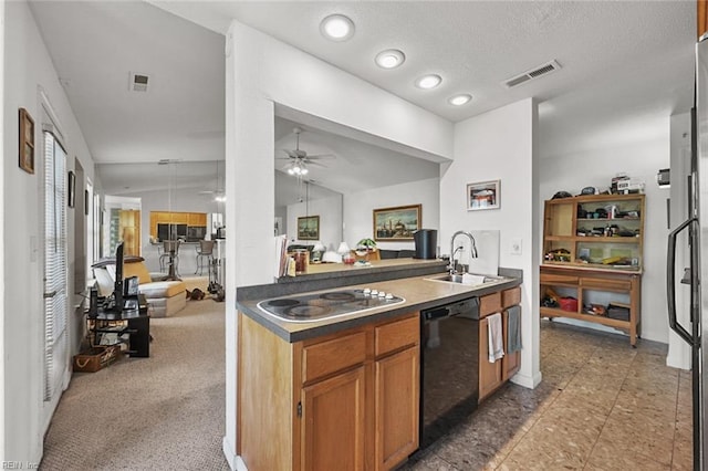 kitchen featuring visible vents, a sink, open floor plan, electric stovetop, and dishwasher