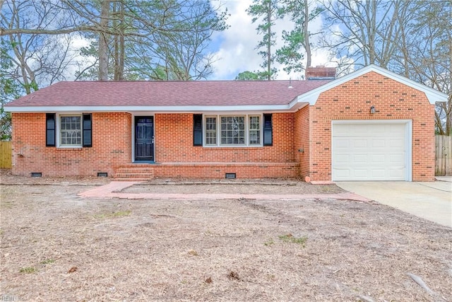 ranch-style house with brick siding, concrete driveway, a chimney, a garage, and crawl space