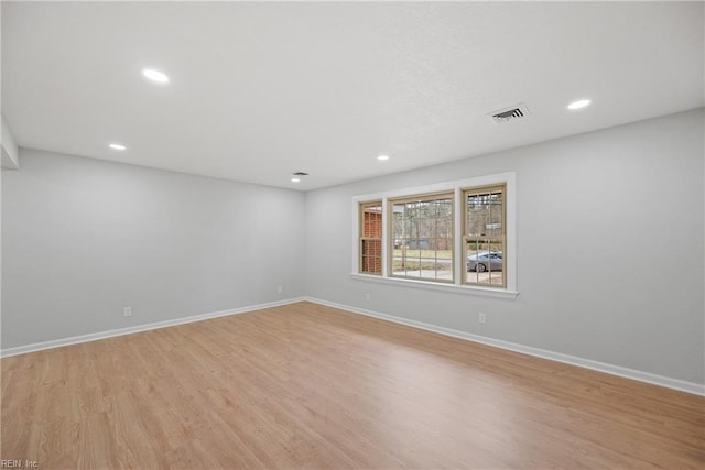 spare room featuring recessed lighting, baseboards, visible vents, and light wood finished floors