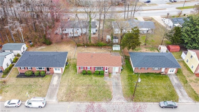 birds eye view of property with a residential view