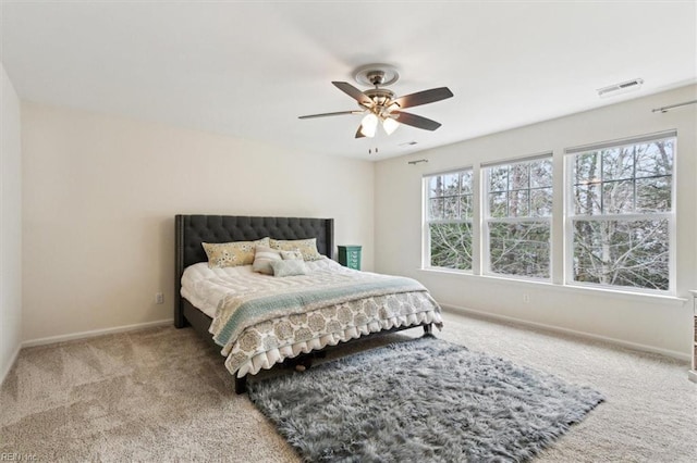 bedroom featuring visible vents, ceiling fan, baseboards, and carpet