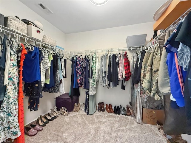 spacious closet with visible vents and carpet flooring