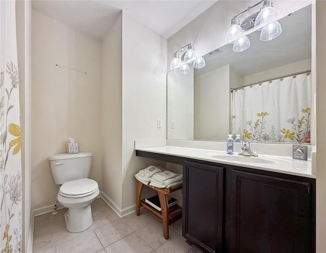 full bath with vanity, tile patterned floors, toilet, and baseboards