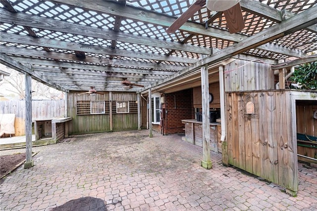 view of patio / terrace with a pergola and fence