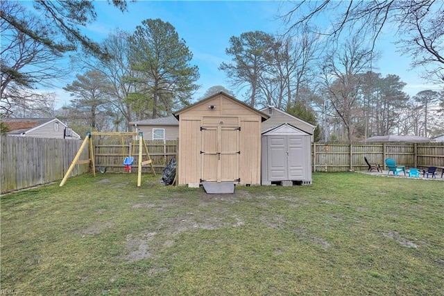 view of shed with a fenced backyard