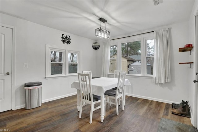 dining space featuring visible vents, baseboards, and dark wood-type flooring