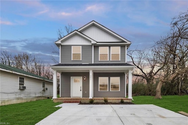 view of front facade with cooling unit, a porch, and a front lawn