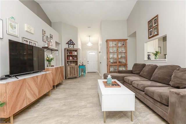 living area featuring high vaulted ceiling